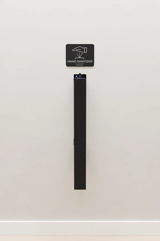 Geysier Wall dispenser mounted on a light wall under a hand sanitizer sign